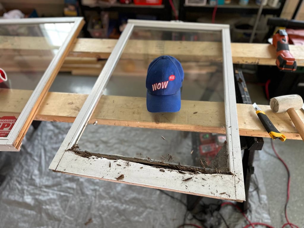 Damaged window frame restoration in progress with WowFix branding cap, showing wood rot repair process and professional tools