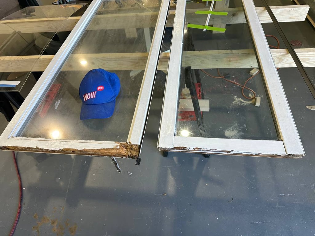 Damaged window frames with wood rot damage showing repair needs, with WOW FIX branded cap demonstrating before-repair condition