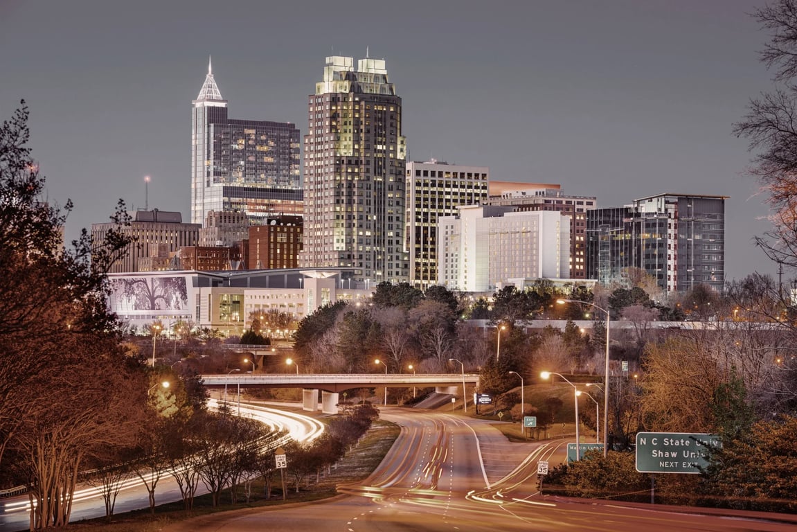 Raleigh and Durham's finest window repair companies showcased against city skyline backdrop.