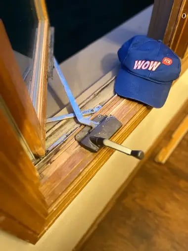 Photo displaying worn-out or broken window hardware, highlighting the need for replacement or repair to restore functionality and ensure proper window operation.