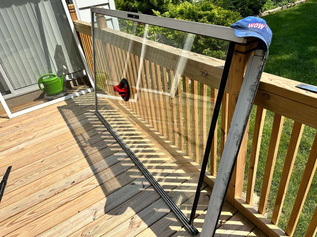 Professional window glass panel installation on wooden deck with WOW branding, showing quality craftsmanship and precision fitting