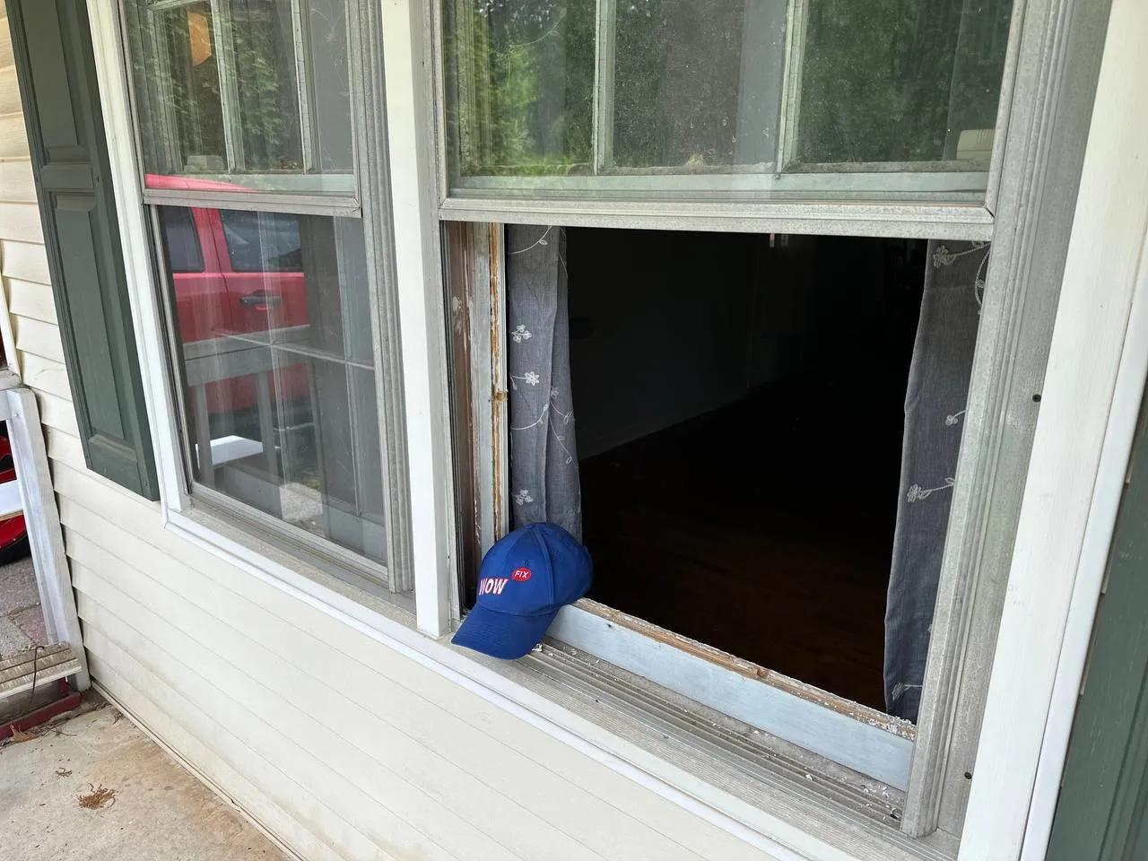 Broken window with removed pane showing empty frame